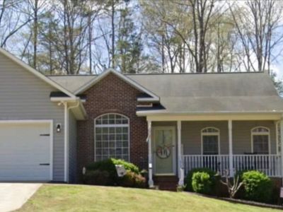 Santos Construction & Roofing crew working on a residential roofing project in Forest City, NC